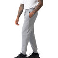 Man wearing grey marle cotton fleece track pants with drawstring waist, side pockets, and ribbed cuffs