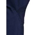 Close-up of navy work shirt underarm panel showing perforated mesh ventilation insert and curved seam detail