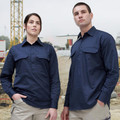 Man and woman wearing navy long sleeve closed front work shirts with twin chest pockets on a construction site
