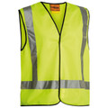 Hi vis yellow safety vest with silver reflective tape in X-back configuration and black binding trim, flat lay