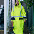 Yellow Bisley Waterproof Hi Vis Taped Long Rain Coat, a high-visibility, full-length coat with reflective safety tape, ideal for night and bad weather outdoor work.