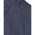 Close-up of slate blue chino pants showing back pocket detail and twill weave fabric texture