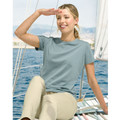 Woman on sailboat wearing a slate blue crew neck short sleeve tee with clean flat front panel