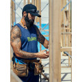 Tradie wearing navy cotton singlet with printed logo on active construction site