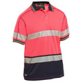 Hi vis polo shirt in coral pink with silver reflective tape and navy contrast panel at hem