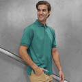 Man wearing a teal short-sleeve polo shirt with ribbed collar and three-button placket