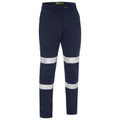 Navy work pants with dual white reflective taped biomotion bands on lower legs, flat front, zip fly