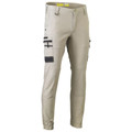 Stone cargo pants with charcoal utility pockets, cuffed ankles and multiple side pockets