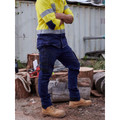 Navy cargo pants with cuffed hems and multiple pockets paired with yellow hi-vis polo featuring navy contrast panels