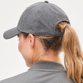 Charcoal grey laser-perforated cap with ponytail opening shown from rear on model with blonde hair