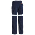 Navy fire resistant work pants rear view with single white reflective tape band across lower leg