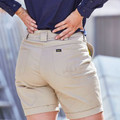 Stone beige mid-rise stretch cotton work shorts with rolled cuffs, multiple pockets and belt loops, rear view