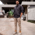 Charcoal long sleeve work shirt with chest pocket and button front worn with khaki cargo pants