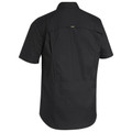 Back view of black short-sleeve work shirt with vented cape, ripstop fabric texture and gold branded tab