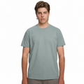 A male model with light brown hair wearing a plain pastel blue Soho Men's Premium New Tech Cotton Face T-shirt, standing against a white background.