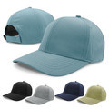 Dusty blue poly-spandex baseball cap with subtle grid texture, structured crown, and micro-velcro fastener — shown with colour variants in black, grey, navy, an