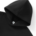 Black oversized hoodie with lined hood and visible white brand label at neck
