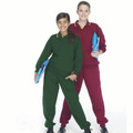 Two people wearing fleece tracksuit sets in bottle green and maroon with elastic cuffs and kangaroo pockets