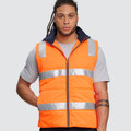 Unisex High Visibility Hooded Puffer Vest featuring a quilted thermal lining, reflective safety tape, and a detachable hood for warmth and visibility in cold outdoor work environments.