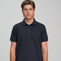 Navy blue polo shirt with collar and button placket in classic pique cotton construction