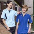 Two kids wearing contrast raglan polo shirts — sky blue with navy panels and royal blue with gold panels — school outdoor setting