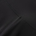 Black high-rise legging shorts showing flatlock seam detail and smooth stretch fabric construction