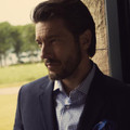 Navy checked shirt with white fine gingham pattern and button-down collar worn under blazer