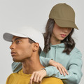 Two models wearing dad hats in white and olive green with curved brims and unstructured crowns