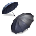 Two navy large-canopy umbrellas — one open showing tonal blue panels, one displaying subtle charcoal checkerboard pattern across 10-panel canopy
