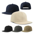 Flat peak snapback caps in navy, stone, black, dark olive and tan — unstructured organic cotton, smooth front panel, snapback closure