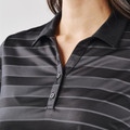 Women's black tonal stripe polo with spread collar and two-button placket, close-up on chest and neckline