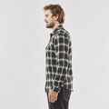 Man wearing charcoal and cream plaid long sleeve shirt with point collar and chest pocket, side profile view