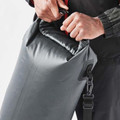 Charcoal grey roll-top dry bag with black carabiner clip, model sealing welded seam opening