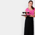 Black long waist apron with wide waistband and flat front panel, shown with fuchsia pink top