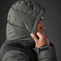 Male model wearing charcoal grey quilted insulated parka hood with structured baffling and contrast black body panel