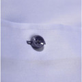 Close-up of charcoal contrast button on white fine-weave fabric of a women's shirt