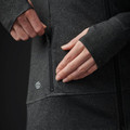 Close-up of charcoal marl jacket zip chest pocket with Stormtech logo detail on women's moisture-wicking fleece