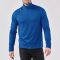 Man wearing royal blue quarter-zip pullover with high collar, raglan sleeves and textured recycled fabric