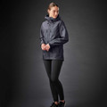 Woman wearing charcoal heather hooded softshell jacket with zip chest pocket and zip hand pockets