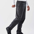 Man walking in charcoal waterproof rain pants with elasticated waist and lightweight shell fabric