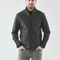 Man wearing charcoal full-zip softshell jacket with stand collar and zippered side pockets