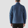 Rear view of man wearing steel blue quilted insulator jacket with stand collar and horizontal baffle stitching
