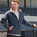 Navy softshell jacket with grey hood lining and reflective piping detail on sleeves
