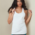 Woman wearing a white racerback tank top with scoop neck, smooth flat front panel and elongated hem
