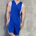Male model wearing royal blue Cooldry basketball shorts with white side panels, paired with matching singlet