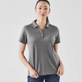 Woman wearing a charcoal grey marl performance polo with spread collar and three-button placket