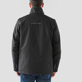 Rear view of man wearing black Stormtech system jacket with storm collar, reflective back detail and clean back panel