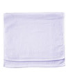 White cotton terry velour golf towel with hemmed edges laid flat against white background
