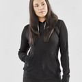 Woman wearing a black waffle-knit pullover hoodie with kangaroo pocket and drawstring hood