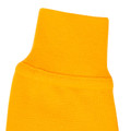 Close-up of amber gold long sleeve polo collar and ribbed neckband in textured pique cotton fabric